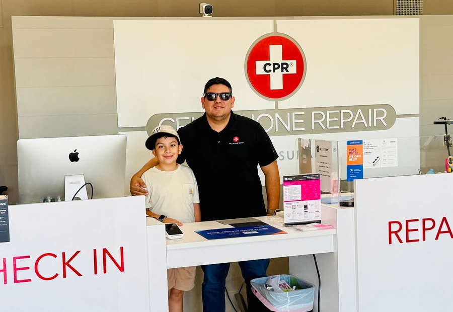 Norvin U. with his son at CPR Cell Phone Repair